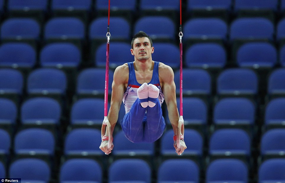 Deserted: Gymnast Pierre Yves Beny of France competes in front of empty seats in the North Greenwich Arena