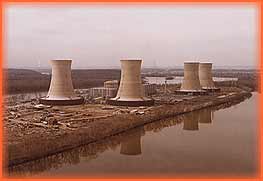Four cooling towers symbolize the nuclear industry. Cooling is needed to reuse water that makes steam.