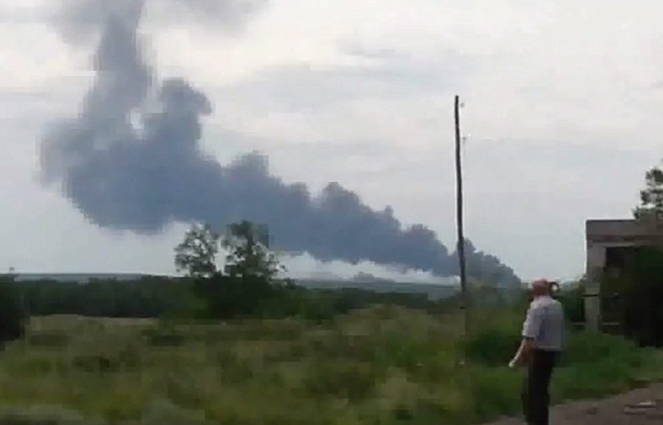 Tragedy: TV pictures show a pall of smoke billowing into the sky apparently from the stricken aircraft