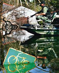 Members of the South Carolina game warden patrols on a boat during a rescue mission in the Gentilly neighborhood of New Orleans